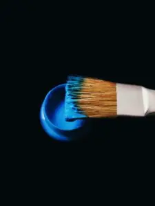 blue paint on a brush